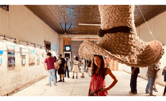 Dundee & Lee artist Emilie Odeile stands beneath her crocheted Tom Mix Wept