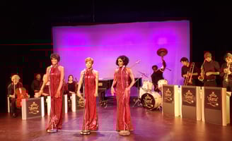 a group of people standing on a stage