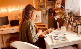 Alex Goddard working on a painting in her home studio
