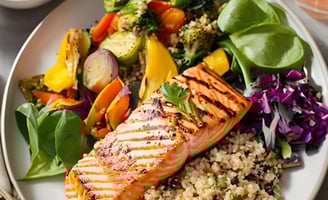 a plate of food with grilled salmon