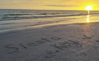 photo of the words Siesta Key written in the sand on Siesta Key