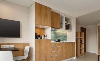 The studio's equipped kitchenette and dining table at Wyndham Residences Alvor Beach