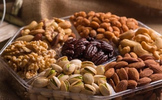 a variety of nuts and nuts in a plastic container