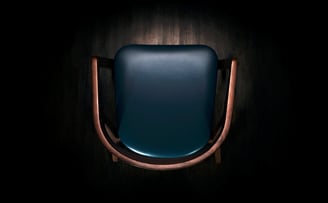 3D marketing design of a modern wooden chair with a detailed wooden frame, armrests, leather cushion