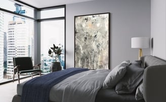 a bedroom with a large abstract painting 