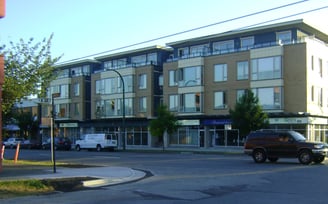 a building with a lot of cars parked in front of it