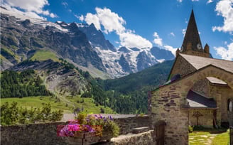 Alps France village church mountains snow blue sky