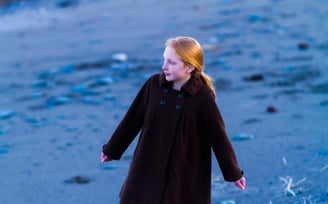 Girl standing on the beach