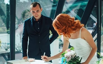 wedding couple signing their papers