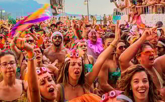 a group of people standing in front of a crowd of people
