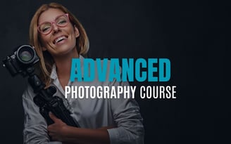 Smiling woman holding a DSLR camera and tripod with text overlay reading Advanced Photography Course.
