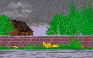 Orange kittne by brick wall in the grass with a cabin behind wall and trees, in a rainstorm.