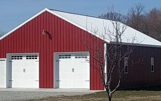 This pole barn was built in Benton, IN with two large access doors and 6 windows.