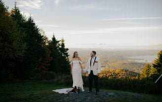 Bride and Groom standing at the top of Mount Sunapee Resort