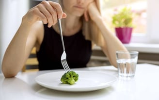 Pushing broccoli around on plate