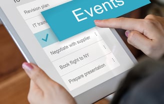A virtual assistant app on a tablet, displaying a calendar with events and reminders. 