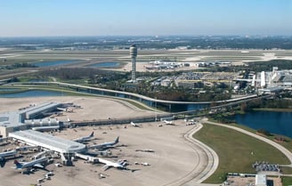 a large airport with a lot of airplanes and planes