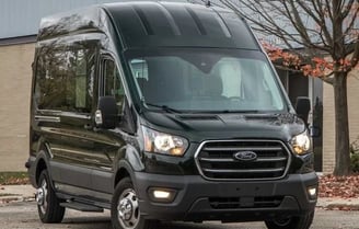 a black van parked in front of a building