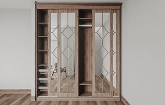 a clothes cabinet with a mirror and a chair