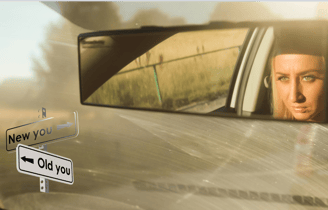 a woman driving a car with a cloudy windshield