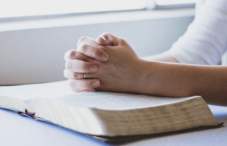 hands joined in prayer -prayers from the church, saints, and scripture