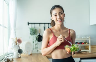 a woman in a red bra top and black bra top