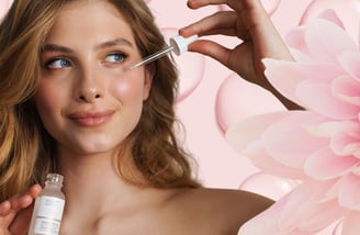 a woman putting serum on her face