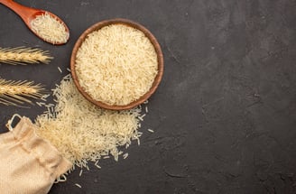 a bowl of rice with a beautiful long thin grain spread all across the image.