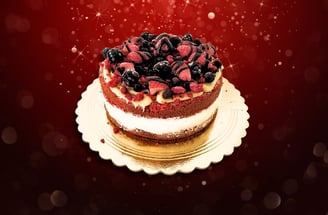 a cake with berries on a plate with a red background
