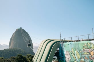 a man on a slider in the mountains