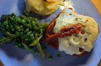 a plate of food with a sandwich and broccoli