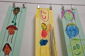 a group of children's drawings on paper