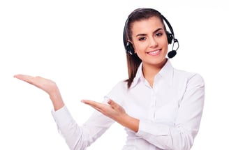 a woman in a white shirt and headphones holding a microphone