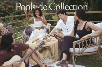 a group of people sitting around a table with a guitar
