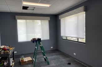 in progress office renovation with new shades and modern carpet design