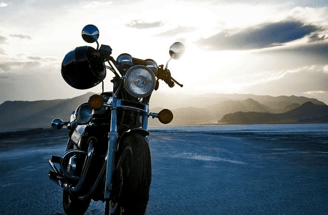 a motorcycle parked on the side of a road