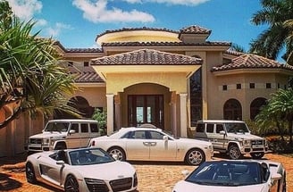 a luxury car parked in front of a house