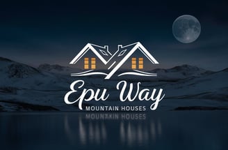 Logo de la empresa, mostrando una ilustración digital de dos casas con un fondo de montañas