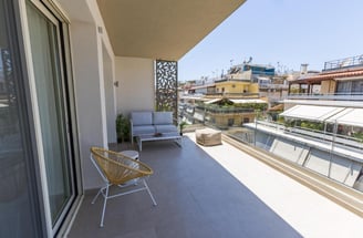 spacious glass outside balcony, 2025, wooden chairs, minimalist style, marina zeas apartments