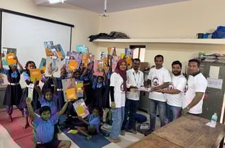 Happy school children with donoriam team