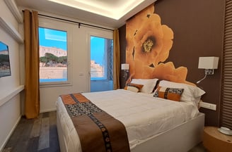 a bedroom with a large bed and a television
