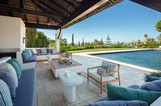 Garden, pool, and Mediterranean views from the pool house at Villa La Gratitud.