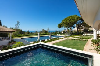 Garden, pool, and Mediterranean views from the pool house at Villa La Gratitud.