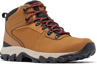 a brown and tan colored hiking boot with red laces