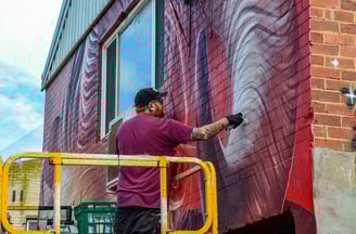The artist Smug at work during the Big Picture Fest in Frankston