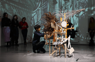 Audience viewing 'Assemble' ikebana performance-installation by Hedy Leung at HIAP Gallery
