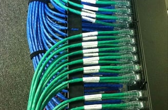 a rack of cables and cables connected to a server