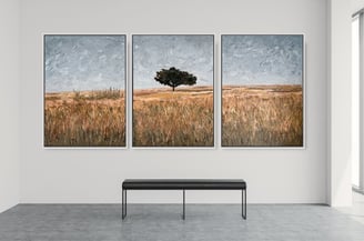 Large triptych painting by Martin Osner showing a single tree in a field of warm brown grasses under a soft grey sky