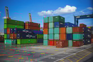 a large amount of containers stacked on top of each other