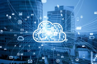 Digital cloud and application icons emerging from a cityscape, representing scalable and platform-ready software integration